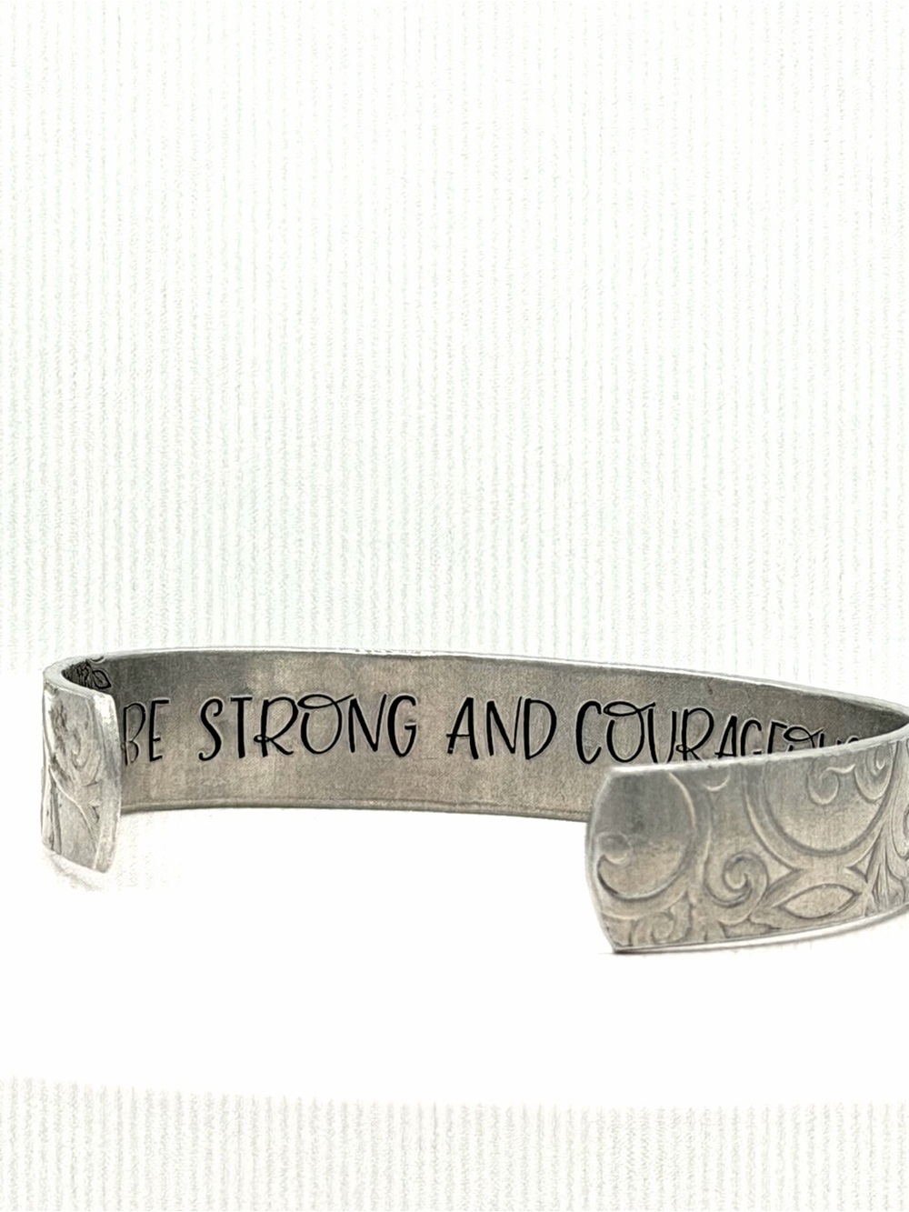 BE STRONG AND COURAGEOUS Embossed Floral Woman’s Aluminum Metal Bracelet